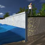 Man inspecting a cross-section of a water reservoir and underground pipeline.
