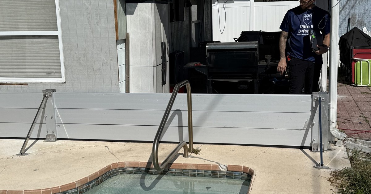 Aqua Shield flood barrier installed around a Gulf Coast Florida home before a storm